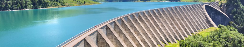 lake and concrete  foothill of a  dam in mountain